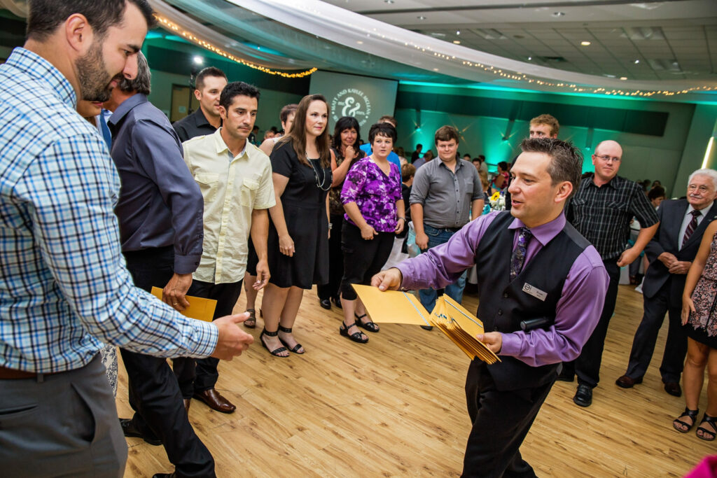 Expressions DJ & MC, Bryan, works with guests for a buffet invitation activity. Photo by Mark Willis Photography